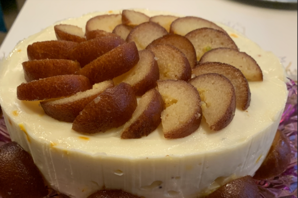 A cake is topped with gulab jamun, a popular Indian treat that consists of fried dough soaked in a sweet, sticky syrup that is typically rose flavored. This cake was made for Diwali in 2020. 